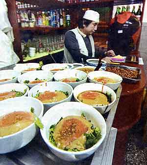 Fig. 18 This photograph shows bowls with condiments lined up to be filled with <i>baodu</i>, a halal tripe dish served in many establishments in old Beijing.